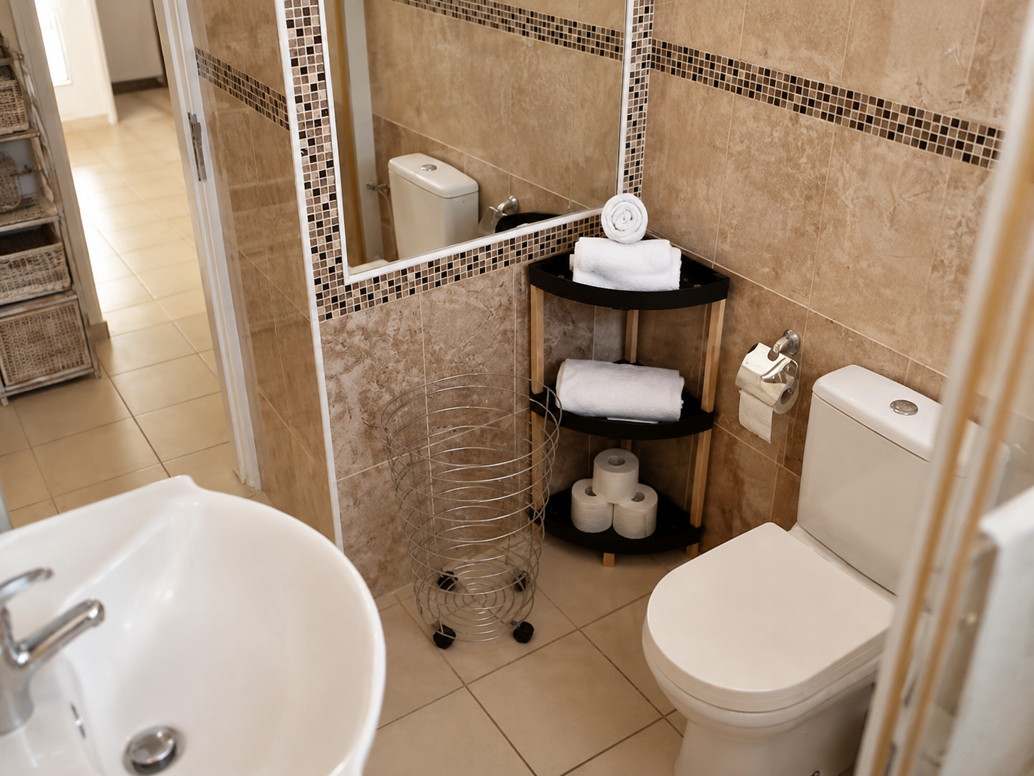 Bathroom vanity, mirror and fresh towels at Pervolia 206 Apartment