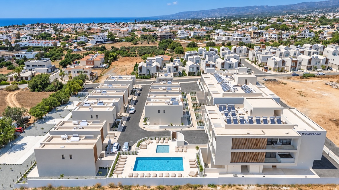 Aerial view of the Avalon Gardens resort in Empa, Paphos, with its pool and the sea in the distance