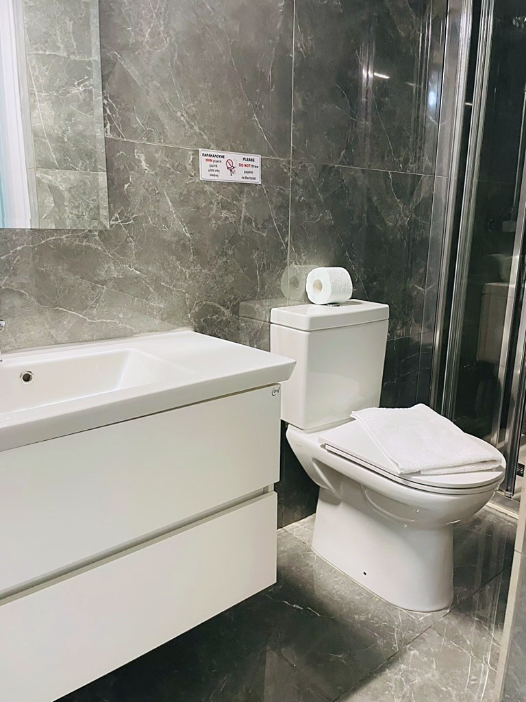 Modern bathroom with walk-in shower at SeaGarden Hideaway, Paphos