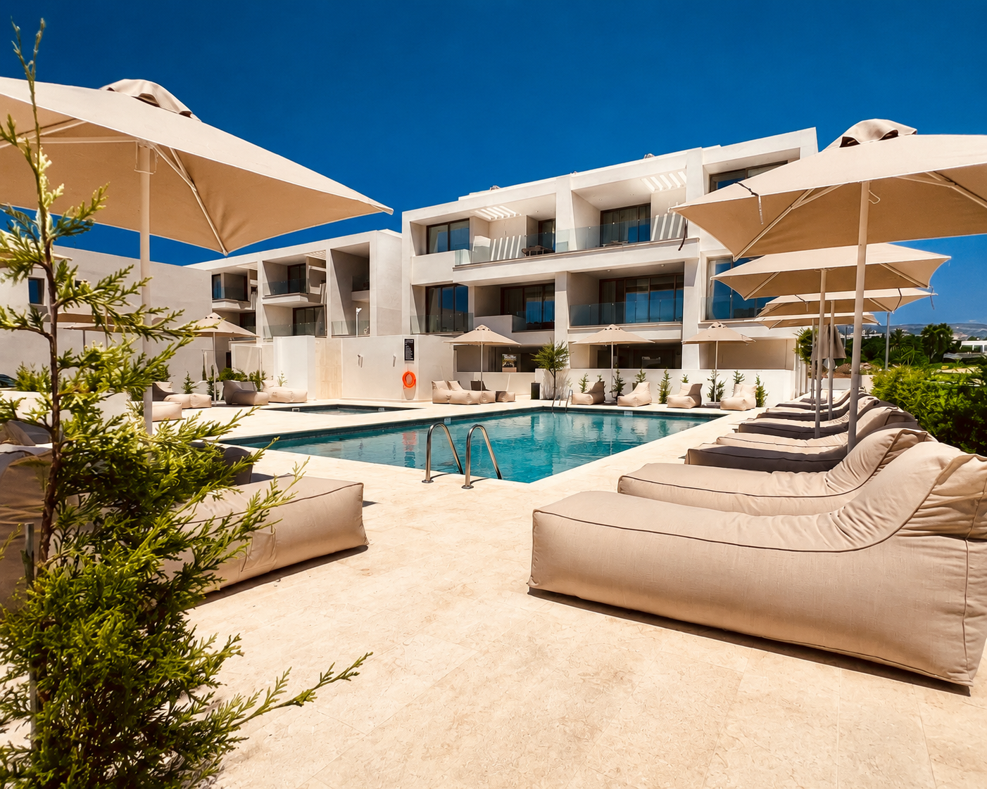 Shared swimming pool and sun terrace at Avalon Gardens