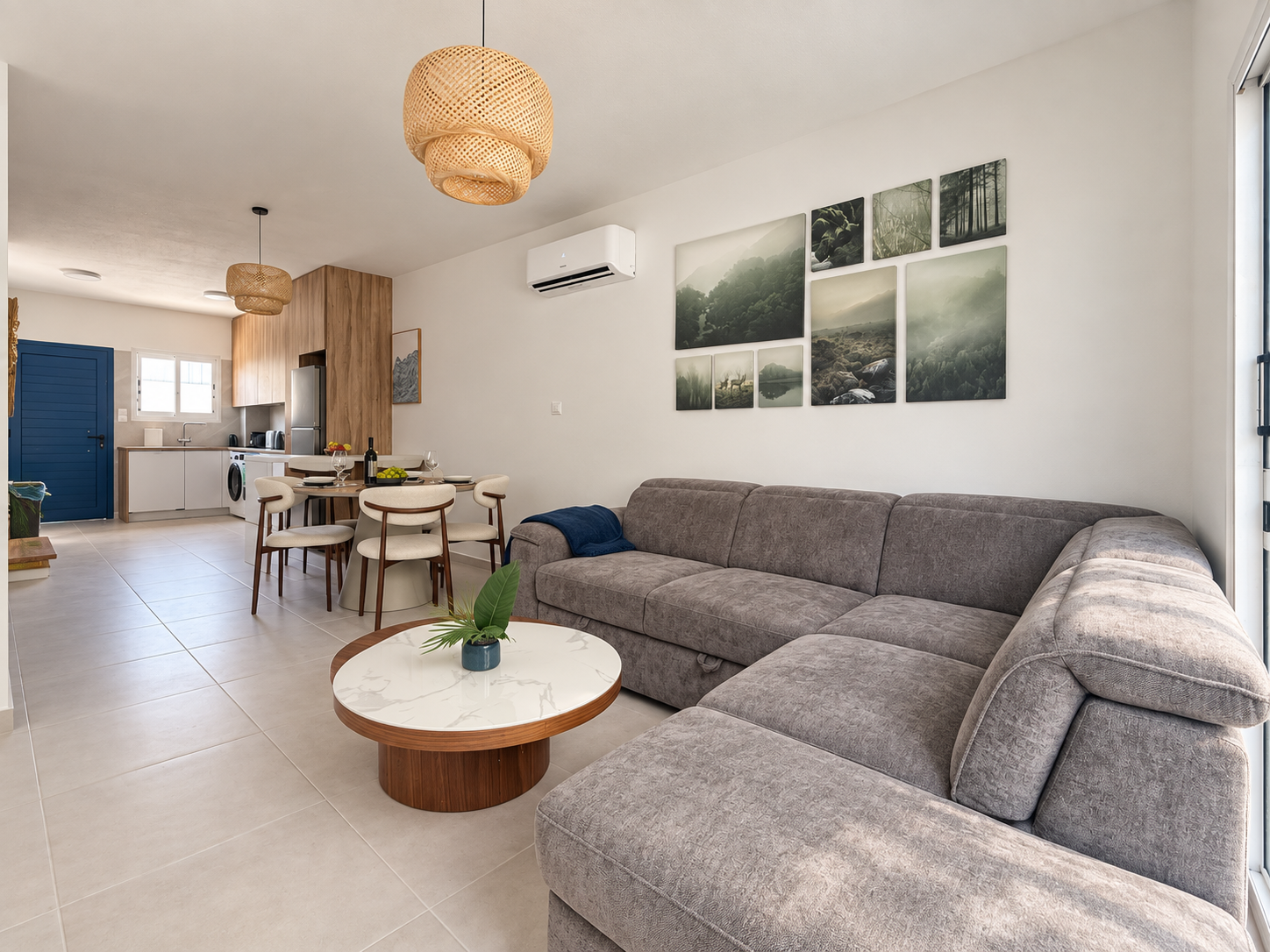 Open-plan living room with large L-shaped sofa and dining area at Paradise Gardens Villa 30
