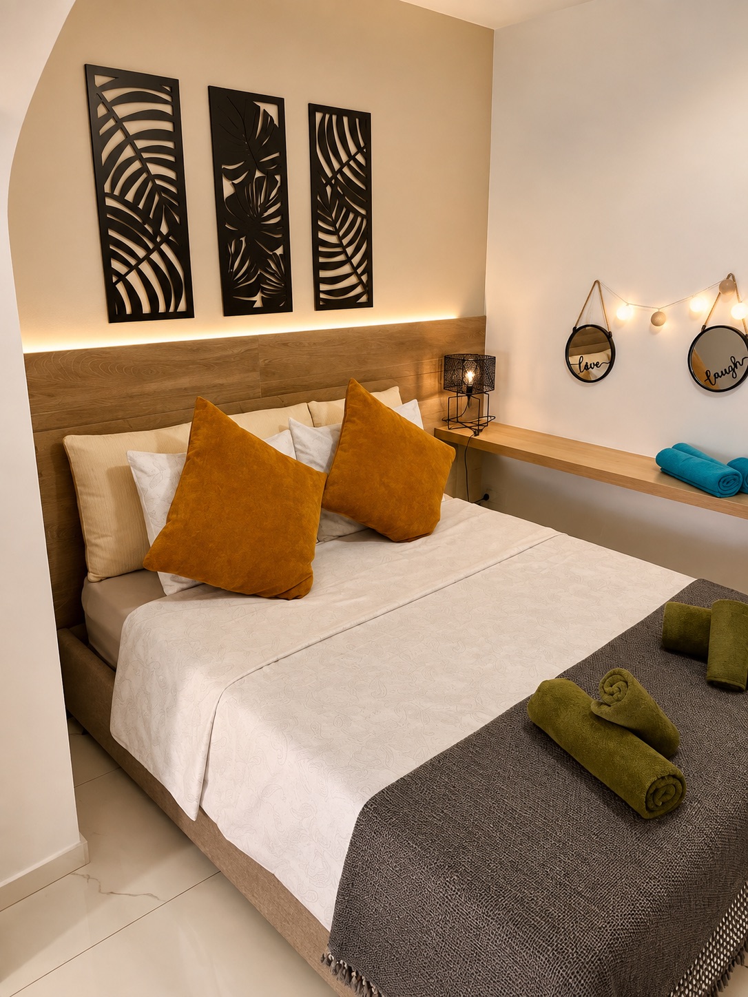 Prepared double bedroom with fresh linen and towels at SeaGarden Hideaway