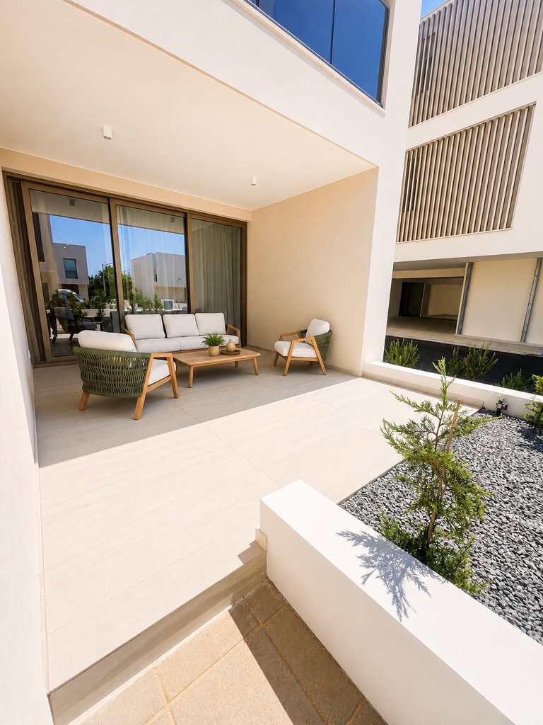 Spacious private covered terrace with outdoor seating at Avalon Gardens A008