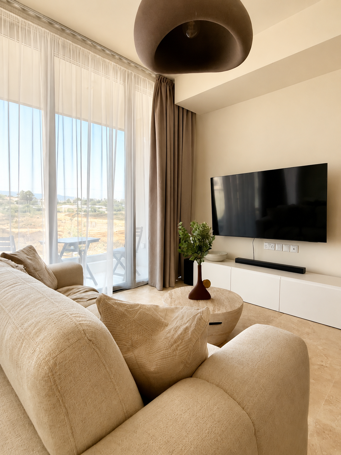 Living area with sofa bed and Smart TV at Avalon Gardens B101